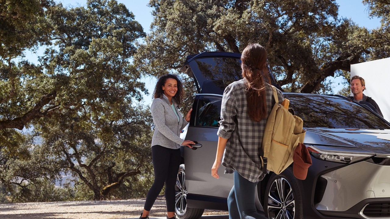 Family and a toyota car